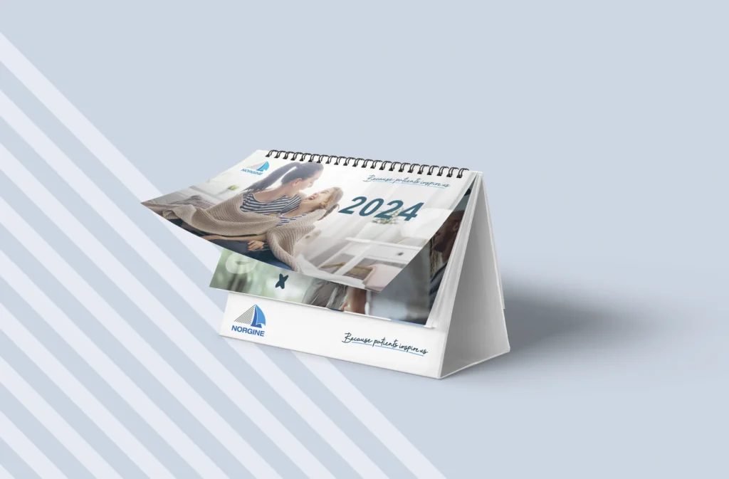 Norgine bureaukalender ontworpen met branding en geproduceerd