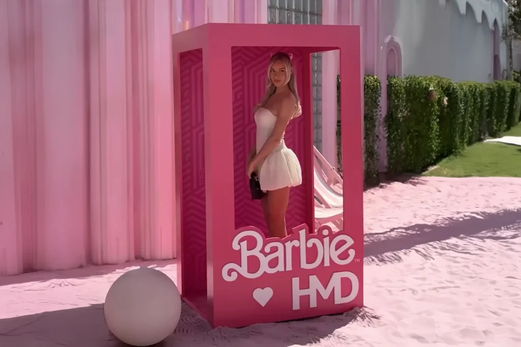 Girl in barbie photobooth